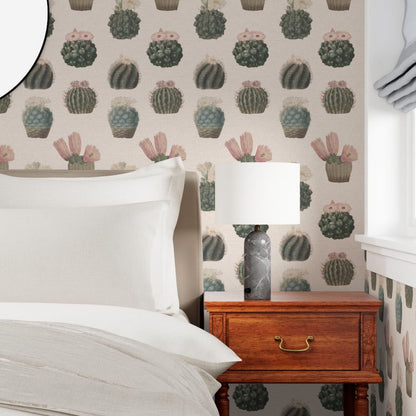 a bedroom with a made bed, wooden side table, and lamp to showcase the wallpaper