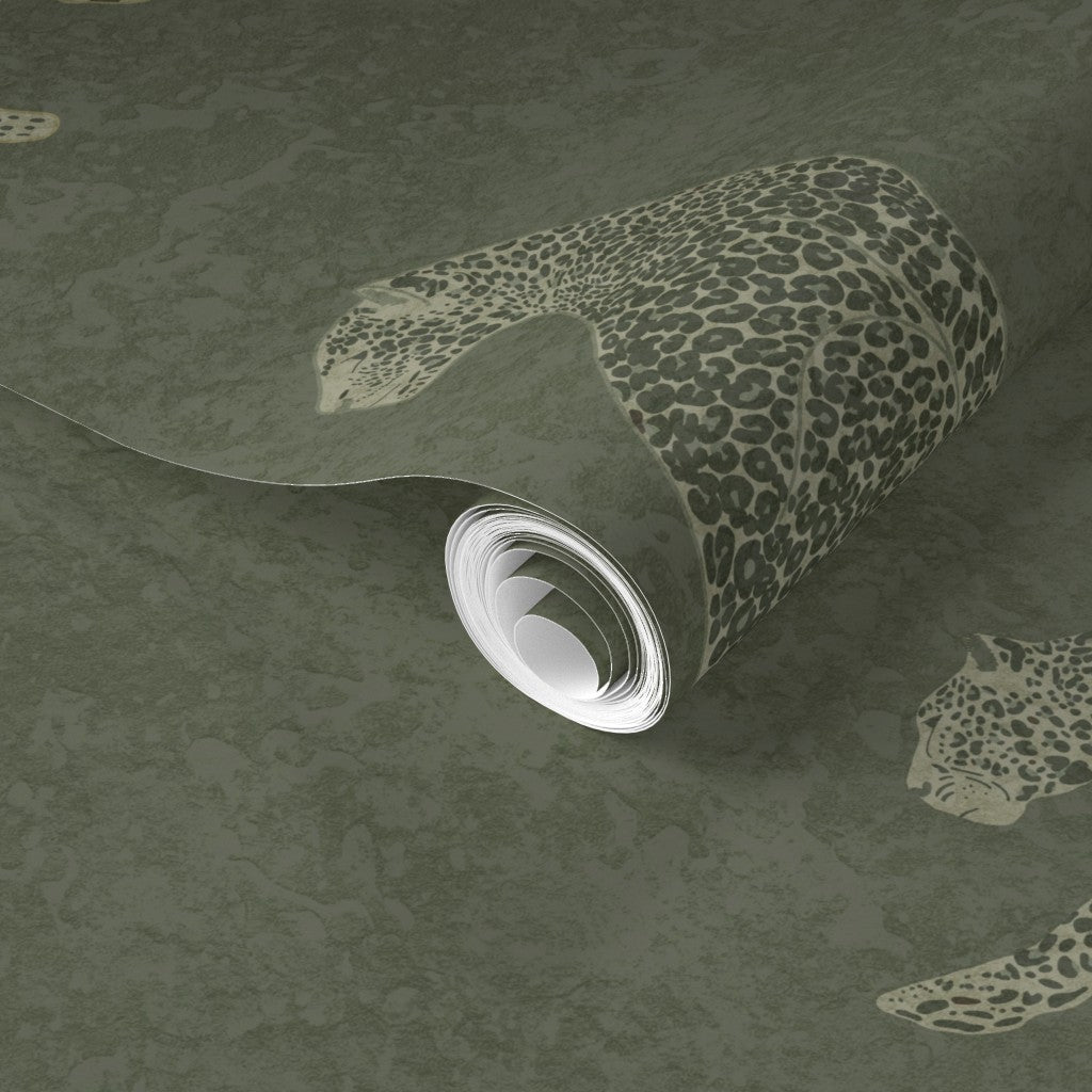 Roll of Cheetah Tadelakt wallpaper in moss on a matching wallpaper background
