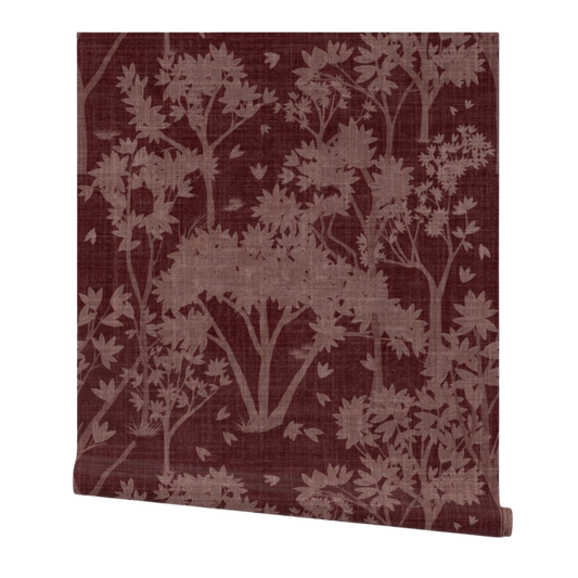 Partially rolled wallpaper with a pink garden pattern on a burgundy background
