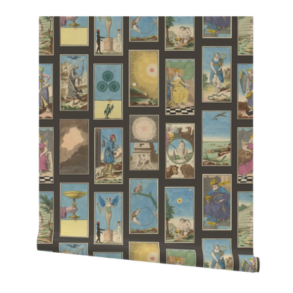 partially rolled wallpaper with a vintage-style tarot cards pattern arranged in a grid on a dark gray background