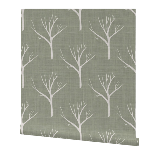 Roll of wallpaper with white tree branches on a green background