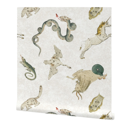 partially rolled wallpaper patterned with illustrations of mythical creatures on a white background